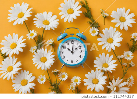 Creative idea layout alarm clock on yellow background with chamomile. Business and dst concept. Ai generation 111744337