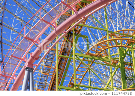 Colorful shapes in the air created by playground equipment Colorful shapes in the air created by playground equipment 111744758