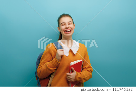 teenager on color paper wall background 111745182