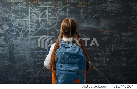 Teenager in class on background of blackboard 111745204