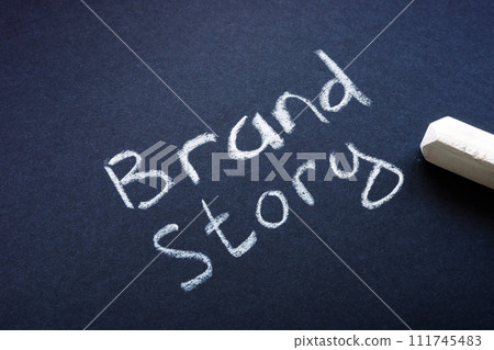 Brand story concept. Handwritten inscription with chalk. Brand story concept. Handwritten inscription with chalk. 111745483