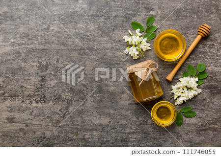 honey jar with acacia flowers and leaves. fresh honey top view flat lay 111746055