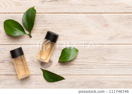 Organic cosmetic products with green leaves on wooden background. Copy space, flat lay 111746546