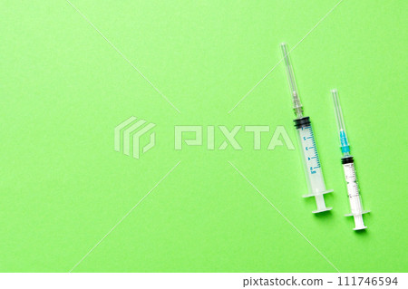 Top view of medical syringes on colorful background. Health care concept with copy space 111746594