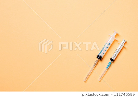 Top view of medical syringes on colorful background. Health care concept with copy space 111746599