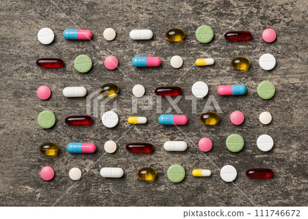 Many different pills and space for text on colorful background, top view. Different pills on color background, flat lay 111746672