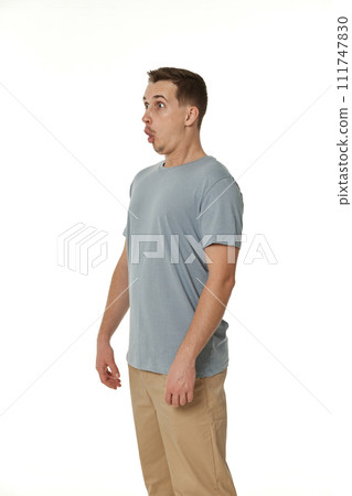 surprised guy looking at camera on white studio background 111747830