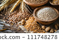 A rustic assortment of whole grains, wheat ears, and cereals displayed in wooden bowls on a textured wooden table. 111748278