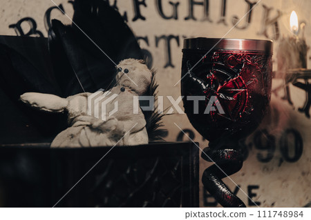 A handmade voodoo doll with pins, set against a rustic backdrop, evoking occult practices. A handmade voodoo doll with pins, set against a rustic backdrop, evoking occult practices. 111748984