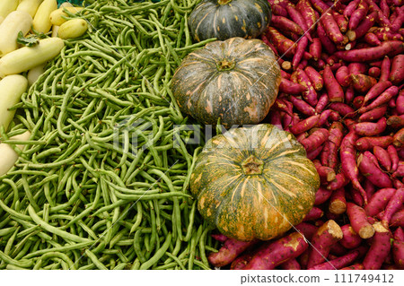 Different organic vegetables sweet potato, green pepper, beans on market. 111749412