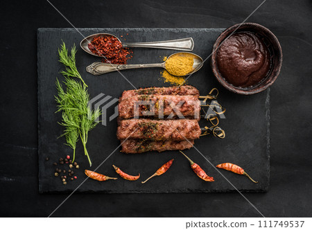 Grilled kebab with spices Grilled kebab with spices 111749537