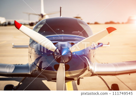 Shiny blue sport plane on the runway Shiny blue sport plane on the runway 111749545