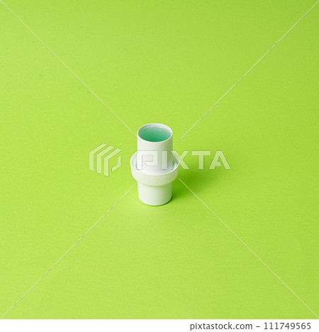 Natural liquid laundry detergent on a green background, copy space for text Natural liquid laundry detergent on a green background, copy space for text 111749565