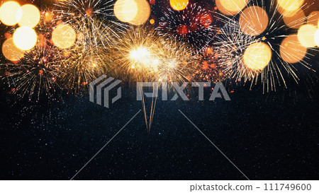 Beautiful golden fireworks on the starry sky with a yellow bokeh light.  New Year 2024 and Christmas card 111749600