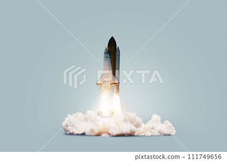 Creative shuttle rocket takes off successfully with blast and clouds of smoke on a blue background, concept. Spaceship launches, creative idea. Start up. 111749656