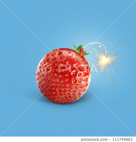 Creative strawberry bomb with wick and sparks burning on a blue background. Vitamins, summer and explosion, creative idea. Healthy food and fruits, concept Creative strawberry bomb with wick and sparks burning on a blue background. Vitamins, summer and explosion, creative idea. Healthy food and fruits, concept 111749661