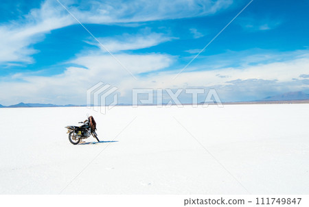 Motorbike on the background of Salar de Uyuni 111749847