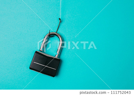 Lock on the fishing hook. Cyber security, phishing, password leak Lock on the fishing hook. Cyber security, phishing, password leak 111752043
