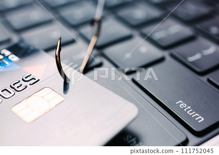 Close-up of credit card on the hook. Phishing concept 111752045