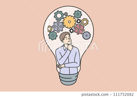 Thoughtful guy comes up with new idea scratching chin and looking at gears inside light bulb 111752082