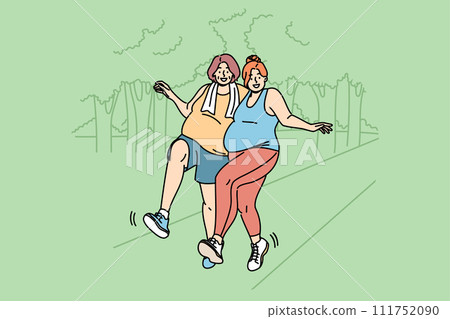 Two bigsize women run through park, doing sports to lose weight and improve well-being 111752090