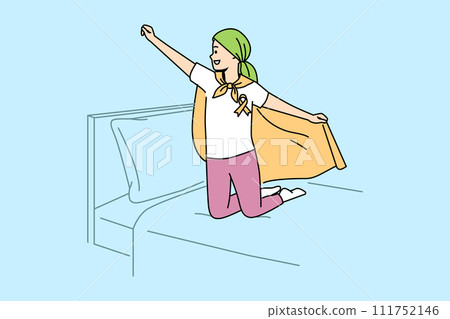 Child with oncology disease stands on bed in superhero pose, for concept day against cancer 111752146