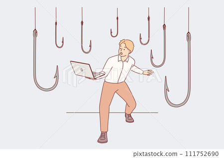 Trap hooks around man with laptop as metaphor for dangers of deception and scammers on internet 111752690