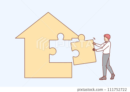 Man real estate agent is building house from puzzles, creating own apartment sales agency. 111752722