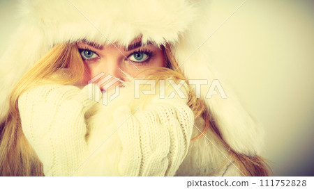 woman wearing warm wintertime clothes, closeup woman wearing warm wintertime clothes, closeup 111752828