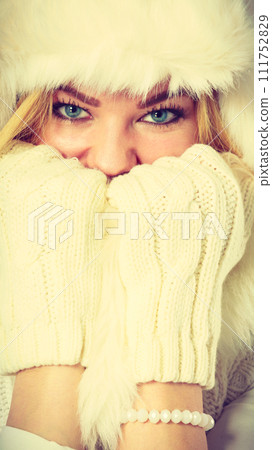 Blonde woman with fur cap. Blonde woman with fur cap. 111752829