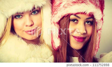 Two girls with winter outfit. Two girls with winter outfit. 111752898