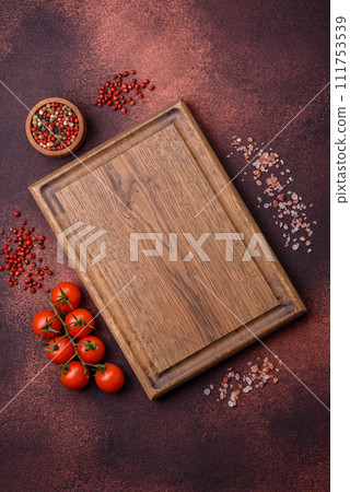 Empty rectangular wooden cutting board on textured concrete background 111753539