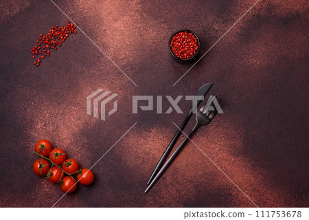 Empty concrete kitchen surface with salt, allspice and cherry tomatoes, copy space 111753678