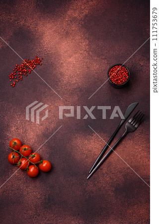 Empty concrete kitchen surface with salt, allspice and cherry tomatoes, copy space Empty concrete kitchen surface with salt, allspice and cherry tomatoes, copy space 111753679