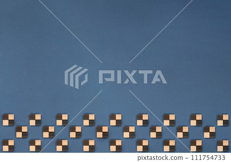 A faded navy blue background with a checkered pattern underneath made of plaid blocks A faded navy blue background with a checkered pattern underneath made of plaid blocks 111754733
