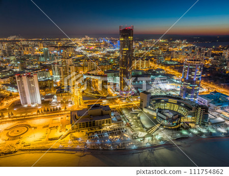 Yekaterinburg city with Buildings of Regional Government and Parliament, Dramatic Theatre, Iset Tower, Yeltsin Center, panoramic view at winter sunset. 111754862