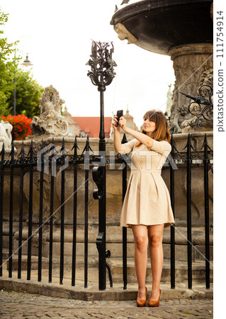 girl taking self picture selfie outdoors 111754914