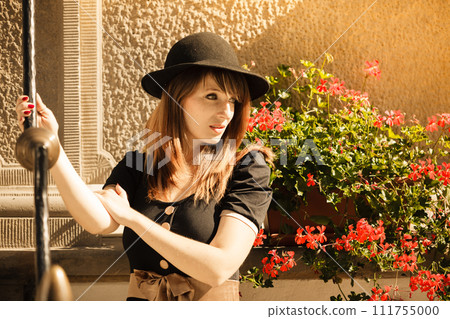 Retro style fashion woman in old town 111755000