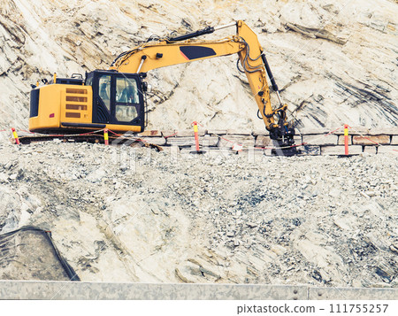 Heavy machine working on construction site, Norway Heavy machine working on construction site, Norway 111755257