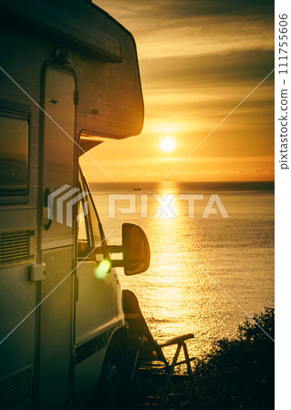 Caravan on sea at sunrise. 111755606