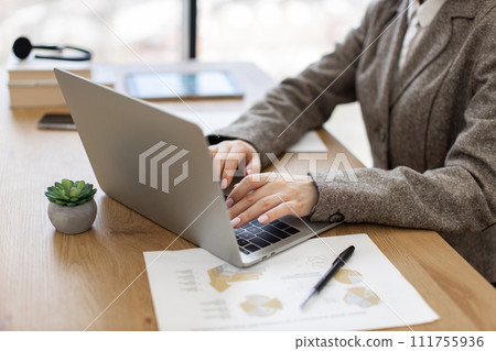Close up of hands of caucasian woman working on laptop. 111755936