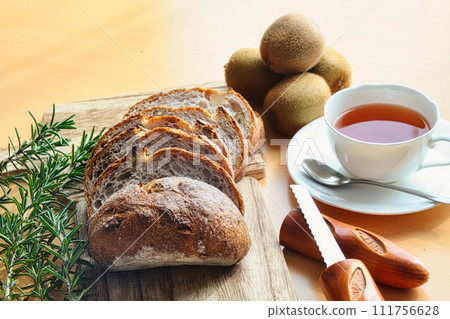 Delicious bread with walnuts on a cutting board 111756628