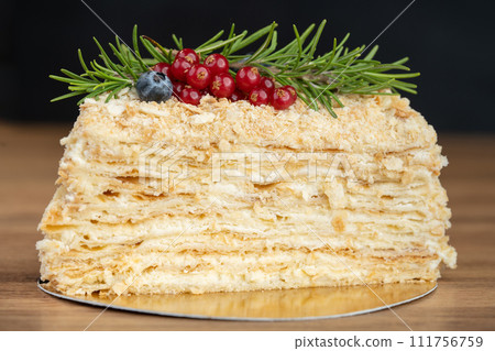 delicious fresh sweet fruit cake decorated with currants and blueberries 111756759