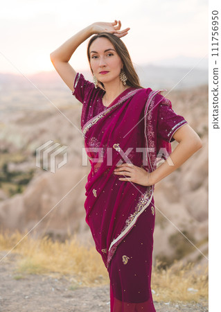 beautiful girl in national Indian clothes on the background of mountains 111756950