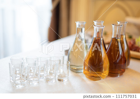 bottles with alcoholic beverages on the buffet table bottles with alcoholic beverages on the buffet table 111757031