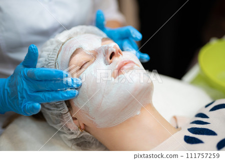 close-up of a girl's face at a cosmetologist during treatment procedures 111757259