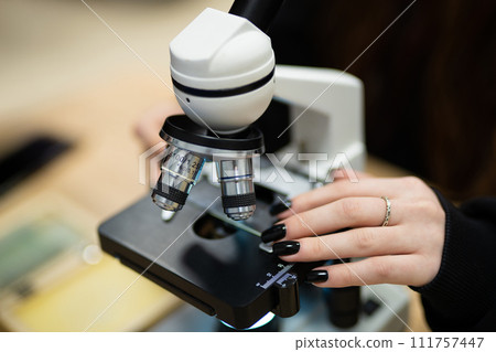 professional microscope in a school laboratory for the study of cells and bacteria professional microscope in a school laboratory for the study of cells and bacteria 111757447