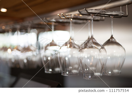 empty clean glass glasses for alcoholic drinks in a restaurant on a bar counter 111757554