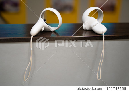 a child in virtual reality glasses plays a game a child in virtual reality glasses plays a game 111757566