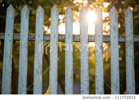 beautiful wooden fence in the village in the contrast sunlight 111758852